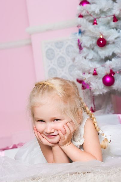 The girl at the Christmas fir-tree with gifts - Φωτογραφία, εικόνα