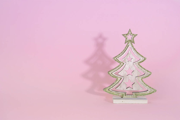 Christmas wooden tree over light blue background. - Foto, afbeelding