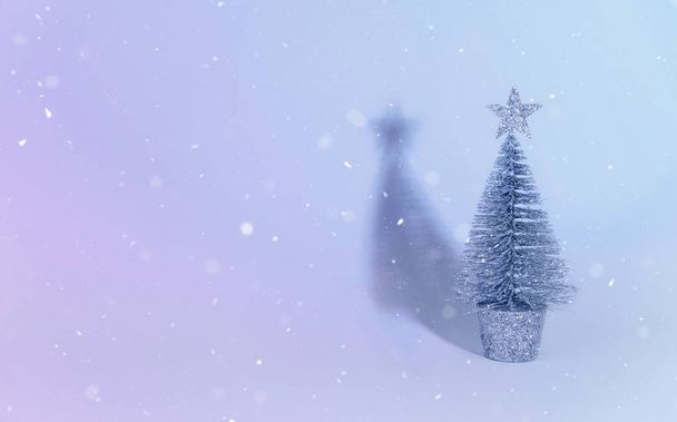 Christmas tree over light blue background. - Photo, Image