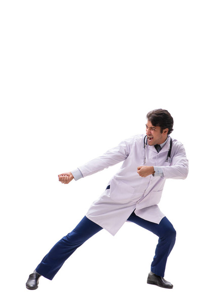 Young handsome doctor under pressure isolated on white - Foto, Bild