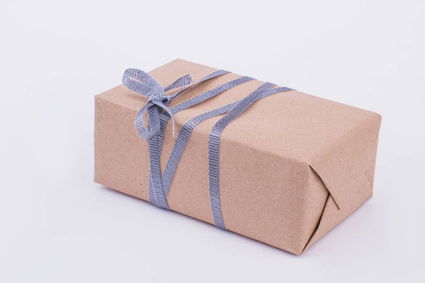 Brown gift box isolated on gray background. - Fotoğraf, Görsel