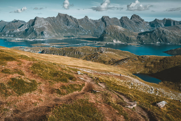 View to Kvalvika beach from mount Ryten in Lofoten Islands Norway on a blue ans sunny day with some clouds. - Foto, Bild