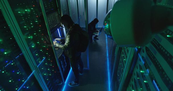 Surveillance camera capturing hackers in server room - Photo, Image