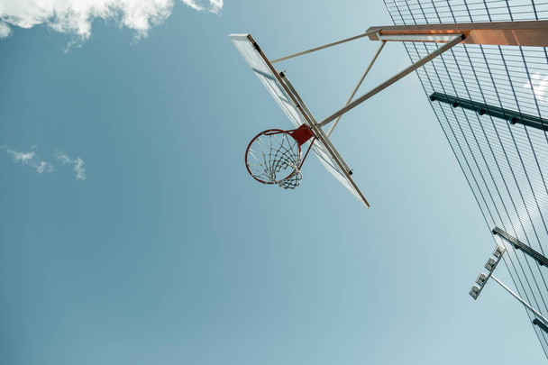 Low angle of an empty basketball basket - Foto, Imagen