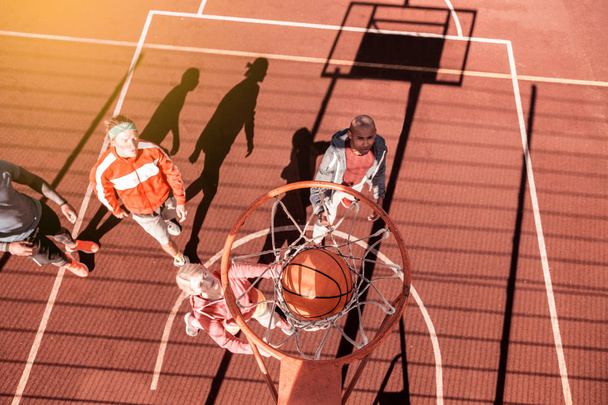 Top view of a ball going through the basket - Foto, Bild