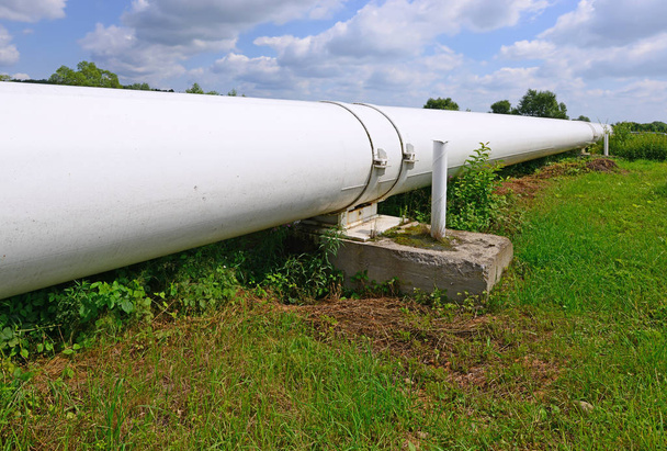 a large white pipe on field - Photo, Image