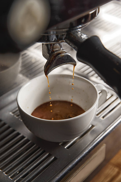 prepares and brews coffee - Фото, изображение