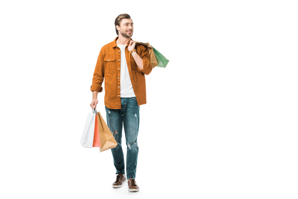 onnellinen mies kävely värikäs ostoskassit eristetty valkoinen
 - Valokuva, kuva