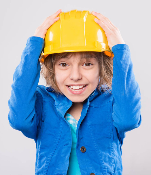 Girl with yellow hard hat - Foto, imagen