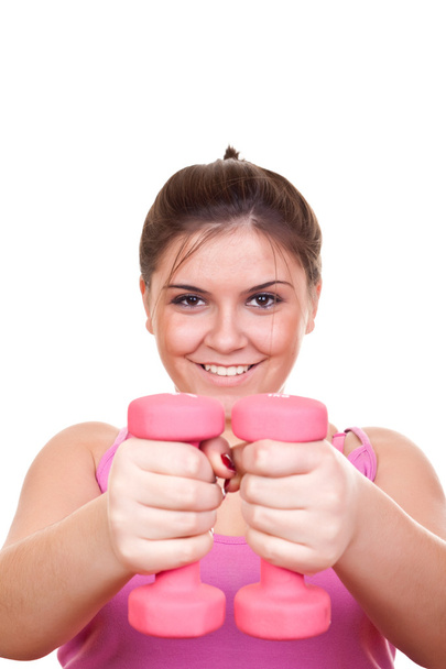 Girl in pink holding weight - Photo, Image