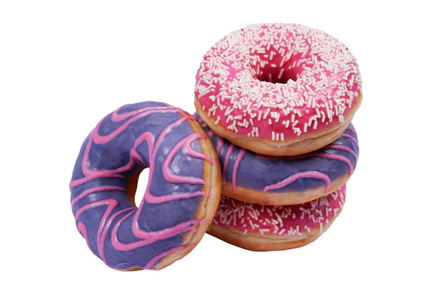 Vier zoete en lekkere roze en paarse donuts met beglazing en glazuur geïsoleerd op witte achtergrond. - Foto, afbeelding