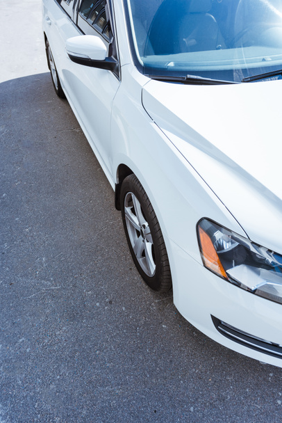 cropped image of new white car on street - Photo, Image