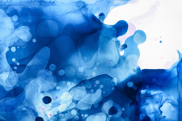 blue and violet splashes of alcohol inks as abstract background - Photo, Image