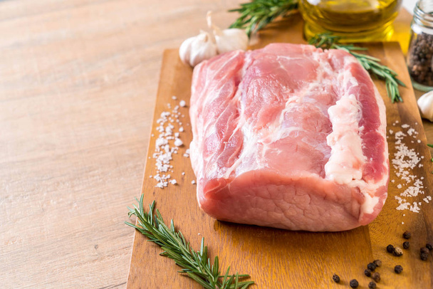 fresh pork raw fillet on wooden board - Fotografie, Obrázek