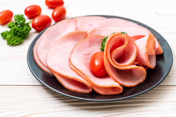 smoked ham sliced on plate - Φωτογραφία, εικόνα
