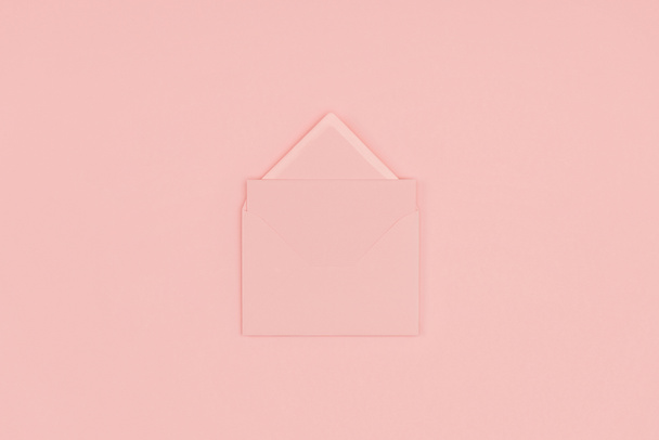 top view of open pink letter isolated on pink background - Valokuva, kuva