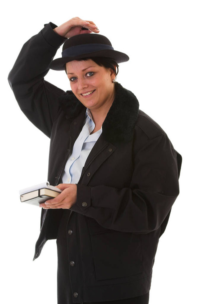 Female police officer holding her little hat - Foto, Imagen