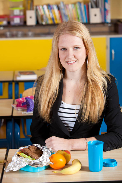 Attractive blond student with healthy take away school lunch - Fotó, kép