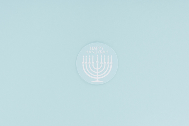 top view of happy hannukah card isolated on blue, hannukah concept - Photo, Image