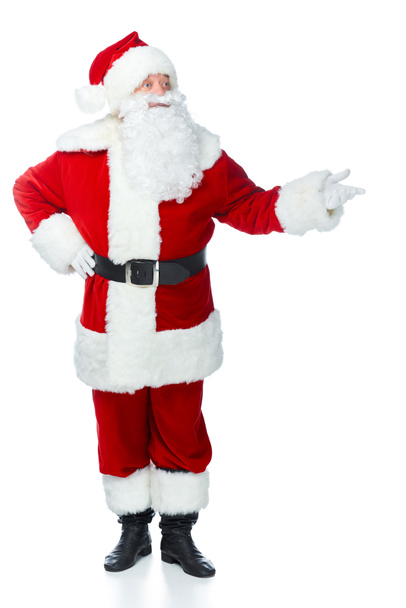 santa claus in red costume presenting something isolated on white - Фото, зображення