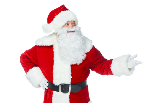 bearded santa claus showing something at christmastime isolated on white - 写真・画像