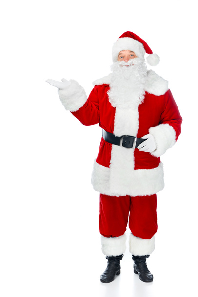 бородатий Санта Клаус в червоному костюмі, що представляє щось ізольоване на білому
 - Фото, зображення