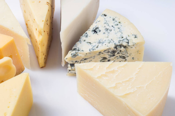 Various types of cheese isolated on white, close up. - Valokuva, kuva