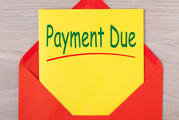 Payment Due written on letter in red envelope. Notice letter. - Photo, Image