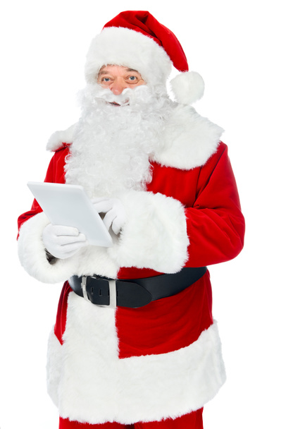 happy santa claus using digital tablet isolated on white - Foto, imagen