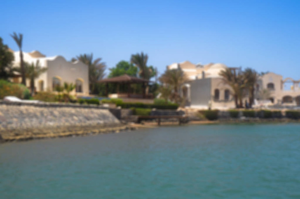 Hermosa vista de la costa con casas y hoteles en el mar rojo. Región turística de Egipto. Hurghada y sus tradiciones. Foto de stock para el diseño
 - Foto, imagen