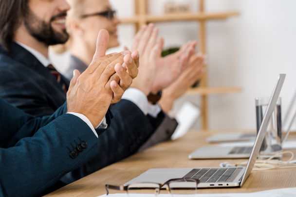 happy business people clapping hands at meeting in office - Photo, Image