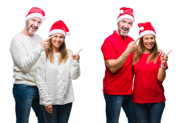 Collage of middle age mature beautiful couple wearing christmas hat over white isolated background smiling and looking at the camera pointing with two hands and fingers to the side. - Fotografie, Obrázek