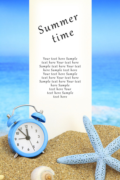 Summer time. White banner and alarm clock on the beach - Photo, Image