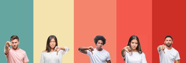 Collage of different ethnics young people over colorful stripes isolated background looking unhappy and angry showing rejection and negative with thumbs down gesture. Bad expression. - Photo, Image
