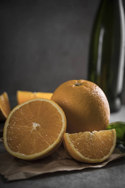 Fresh orange fruits on dark background. - Φωτογραφία, εικόνα