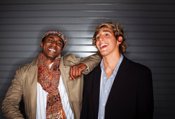 Fashionable diverse friends laughing and hanging out. - 写真・画像