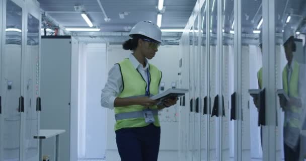 Female electrical worker reading paperwork - Footage, Video
