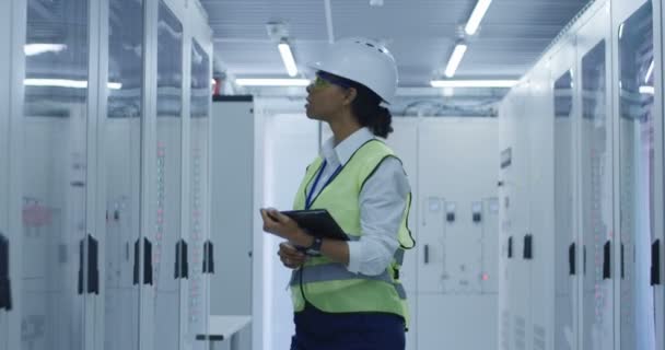 Female electrical worker performing an inspection - Footage, Video