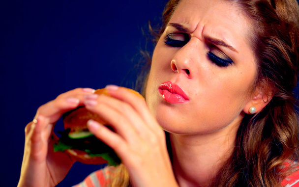 Woman bite hamburger fast food. - Photo, Image
