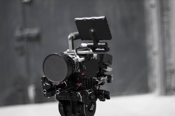 Professional cinema digital video camera on a tripod. - Photo, Image