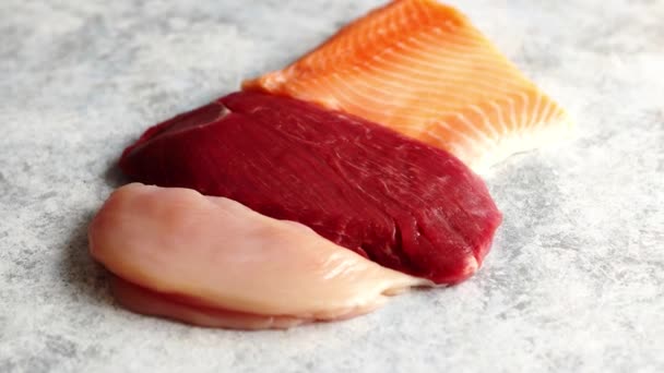 Fresh raw beef steak, chicken breast, and salmon fillet - Footage, Video