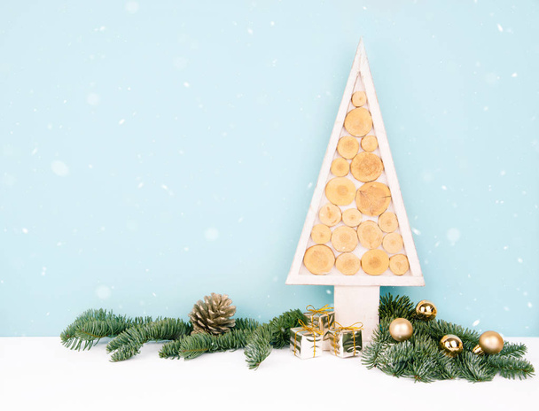 Christmas wooden tree over dark light blue background. Eco style with space for your text. - 写真・画像