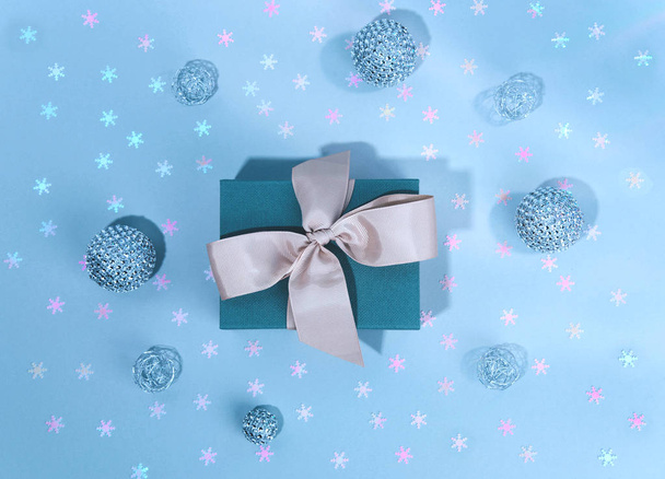 Blue gift boxe with Silver shiny Christmas bauble decoration. - Φωτογραφία, εικόνα