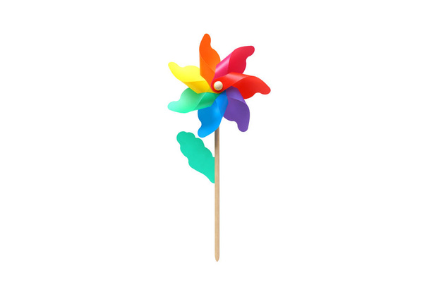 Toy windmill propeller set with multicolored blades in a flower shape isolated on white                                - Foto, Imagen