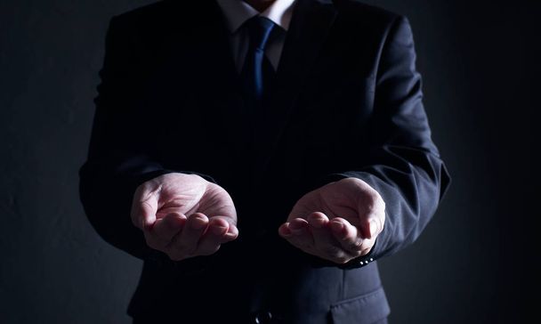 Closeup businessman open and holding hand gesture pose  - 写真・画像