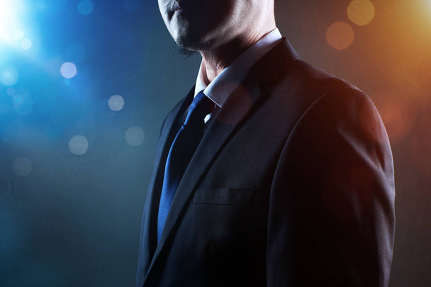 Closeup business man with crossed arms with bokeh and light flare effect apply . - 写真・画像