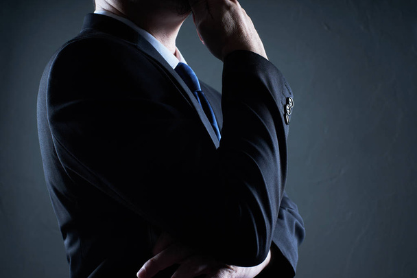 Close Up three quarter front view of businessman with thinking pose - Photo, image