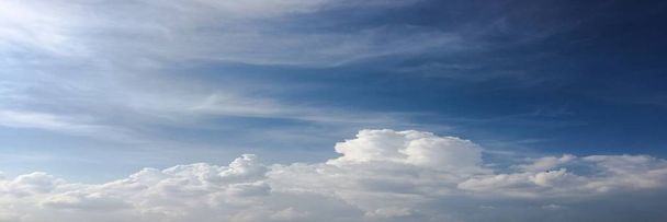 Beauty cloud against a blue sky background. Sky slouds. Blue sky with cloudy weather, nature cloud. White clouds, blue sky and sun - Photo, Image