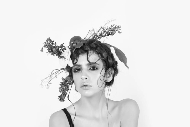 woman with stylish makeup and natural flowers in hair - Fotoğraf, Görsel