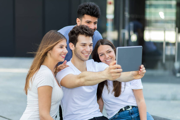 Group of friends taking selfie with a tablet - Photo, Image